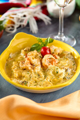 Baked Seafood in Cheesy Sauce - Delicious Gourmet Dish in Vibrant Yellow Plate