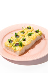 Baked Sushi Roll with Cheese Topping and Unagi Sauce on Pink Plate