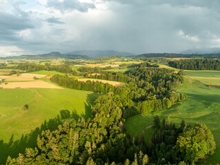 Obraz premium Aerial view of rural landscape with farmland in Switzerland. Pattern of fields.