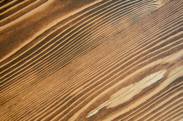 Pattern of striped wood. Background texture of dark wood.
