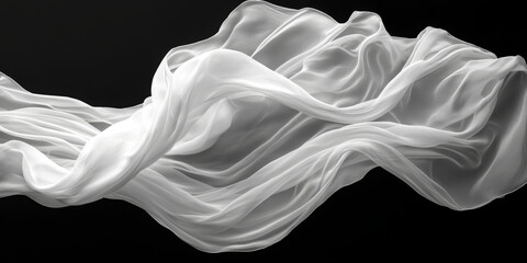 White fabric flowing gently against a black backdrop.