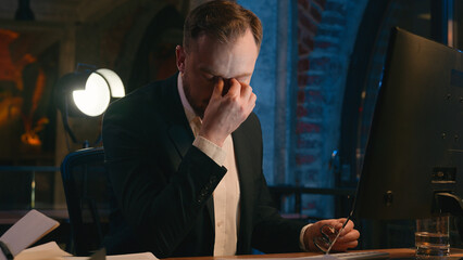 Caucasian businessman guy business man male working computer at night overtime office late time...