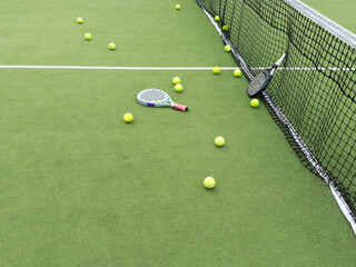 paddle tennis objects in court, racket and balls