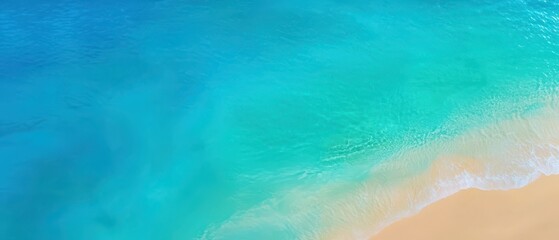 Top view of a tranquil beach with soft sand and sparkling turquoise waters, perfect for relaxation and inspiration.