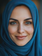 Naklejka premium Woman with blue headscarf smiling