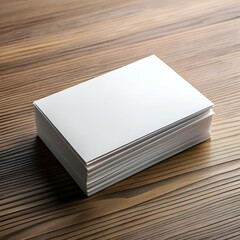 Fototapeta premium A stack of blank business cards on a rustic wooden surface. perfect for showcasing your branding or design mockup.