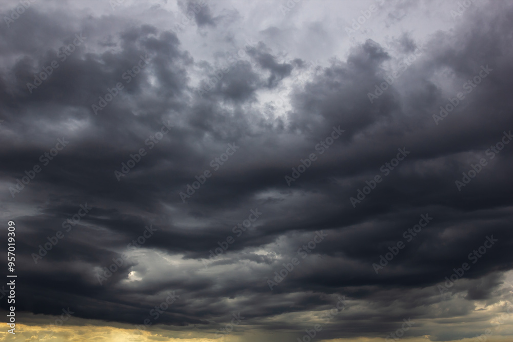 Poster the dark sky with heavy clouds converging and a violent storm before the rain.bad or moody weather s