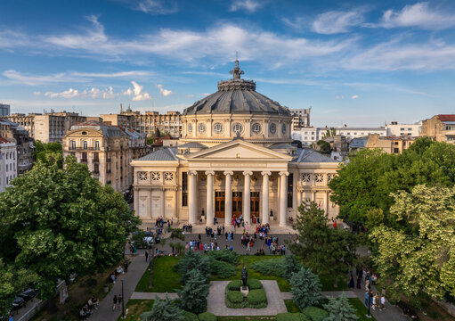 Romanian Atheneum in Bucharest during a summer sunset. Aerial view of this amazing landmark historical building from Bucharest, Romania, on Victoriei Avenue (Calea Victoriei). Travel to Romania.