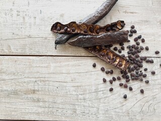 Carob seeds on the table.
