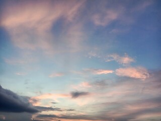 A clear blue sky with a few clouds. The sky is so clear that it almost looks like a painting