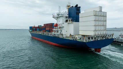 Fototapeta premium logistic cargo container ship sailing in sea to import export goods and distributing products to dealer and consumers across worldwide, by container ship Transport business.