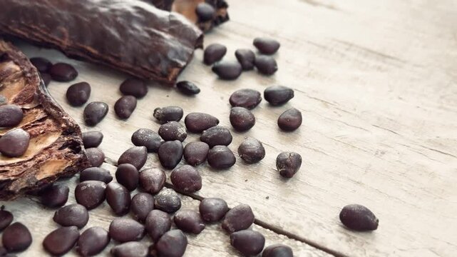 Carob seeds on the table.
