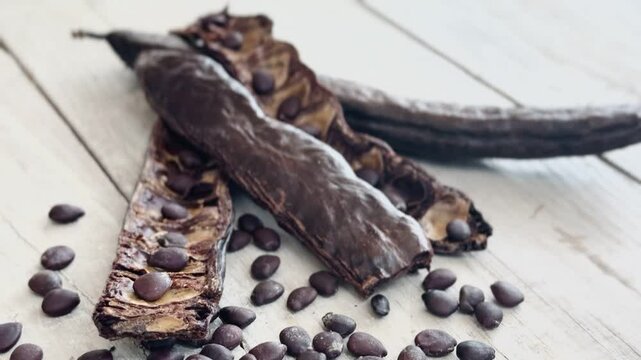 Carob seeds on the table.
