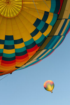 Looking up at a hot air balloon in the sky
