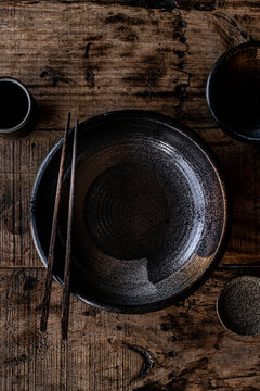 Mix of brown ceramic plates and bowls