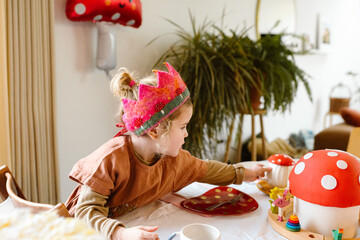 Little girl having tea