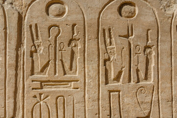 Egyptian ancient hieroglyphs on the stone wall