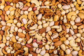 Background of the various nuts (almond, cashew, hazelnut, pistachio, walnut). Vegetarian meal. Healthy eating concept