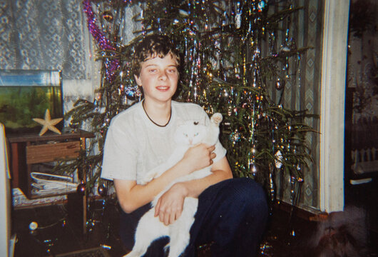Boy with White Cat by Christmas Tree