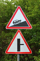 A road sign with a car on it