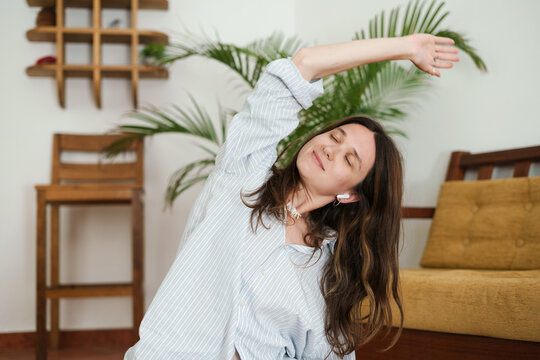 Woman Stretching on Floor