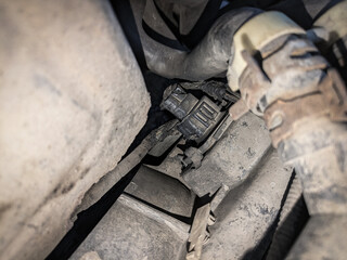 Burnt wiring of radiator fans in a car. Melted connector contacts and wiring.