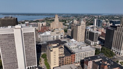 Fototapeta premium Living and working in Buffalo, New York, City skyline with office towers parks, by Lake Erie on sunny summer morning in old American City