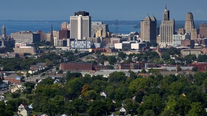 Naklejka premium Living and working in Buffalo, New York, City skyline with office towers parks, by Lake Erie on sunny summer morning in old American City