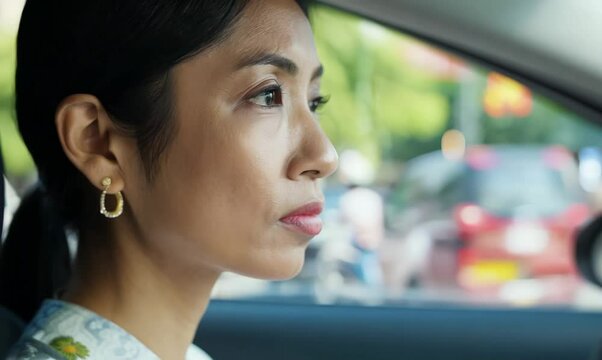 Indonesian Woman Expertly Parallel Parking in Busy Street