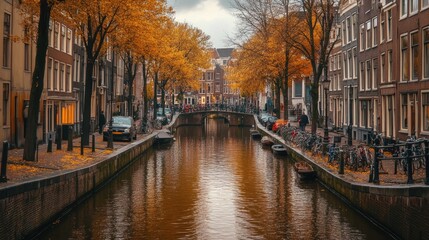 Fototapeta premium The peaceful canals of Amsterdam, Netherlands, lined with historic buildings and trees, with no one around.