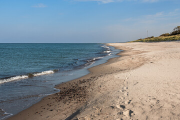 Long white sand beach in the Curonian Spit National Park. Kaliningrad region. Russia