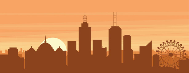 Obraz premium Brown panoramic poster of the city skyline with misty background buildings, sunrise, clouds and mountains of MELBOURNE, AUSTRALIA