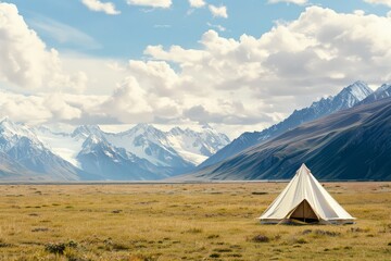 A lone white tent set against the backdrop of expansive plains and majestic snow-capped mountains under a partly cloudy sky.