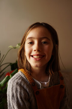 Portrait of a 9 year old girl on the couch at home