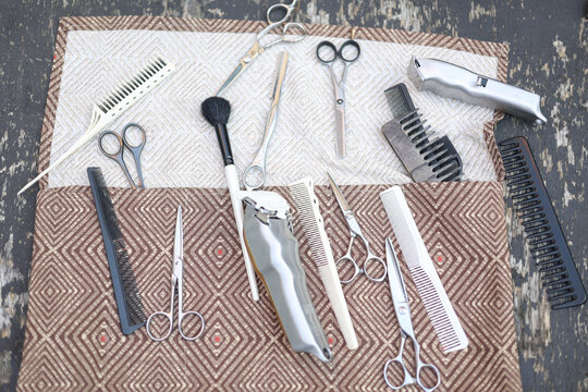 Hairdresser professional tools over antique wood table