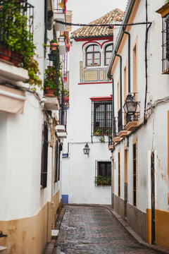 A narrow, cobblestone street in Cordoba, Spain.