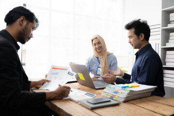Collaborative Brainstorming: Diverse team members gather around a table, engrossed in a lively discussion, their faces radiating focused energy as they brainstorm ideas and collaborate on a project. T