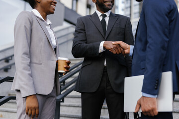 Entrepreneur shaking hand of business partner