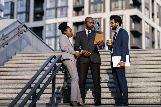 Disgruntled boss talking to office employee outdoors