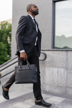 Serious entrepreneur going to work in office building