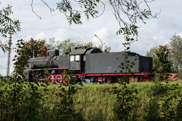 Russia, Republic of Karelia, Russia - 2 September 2023: Black retro steam locomotive from USSR times in Sortavala at sunny day.
