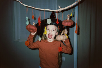 Excited kid with halloween pumpkins