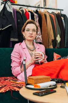 Fashion Designer Enjoying Coffee in Studio