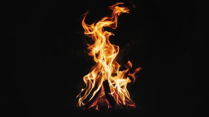 Fototapeta premium Dynamic orange dancing flames on a black background, showcasing the beauty and warmth of fire in artistic form.