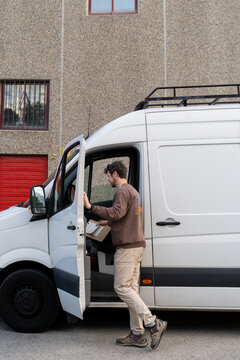Delivery man working with his van