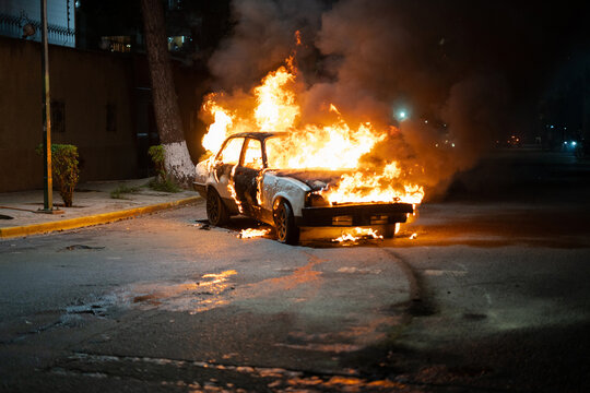 A car burning in the street