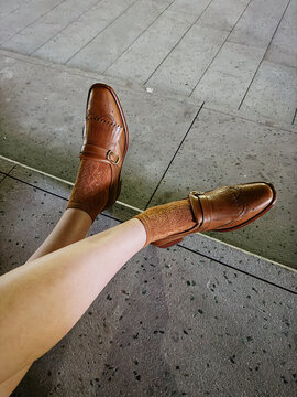 Legs with Brown Loafers and Patterned Socks