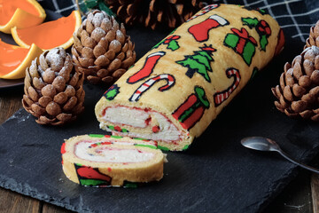 Christmas desserts: roll with traditional Christmas patterns, chocolate cakes shaped tree cones and...