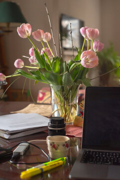 Tulips and technology on table with natural light
