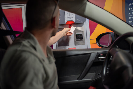 Candid moment paying car park ticket